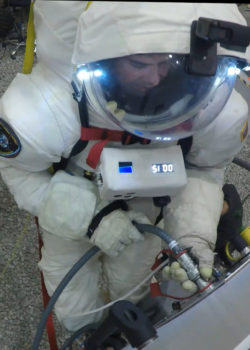 PoSSUM scientist-astronaut candidate tests EVA space suit in simulated zero-G conditions.